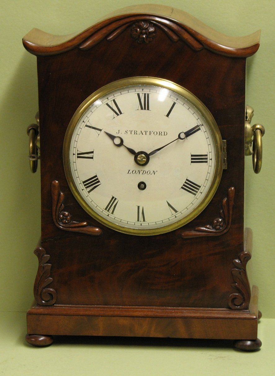 Mahogany mantel timepiece by J Stratford, London.