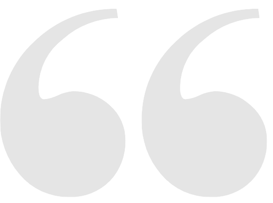 A pair of gray quotation marks on a white background.