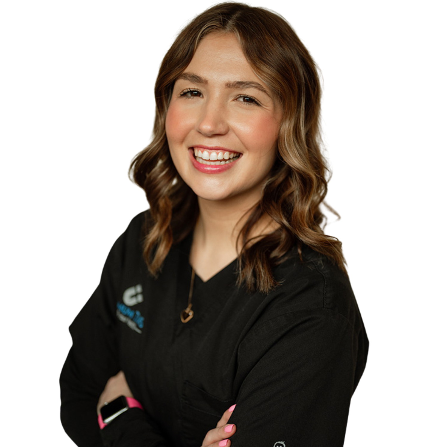 A woman in a black shirt is smiling with her arms crossed