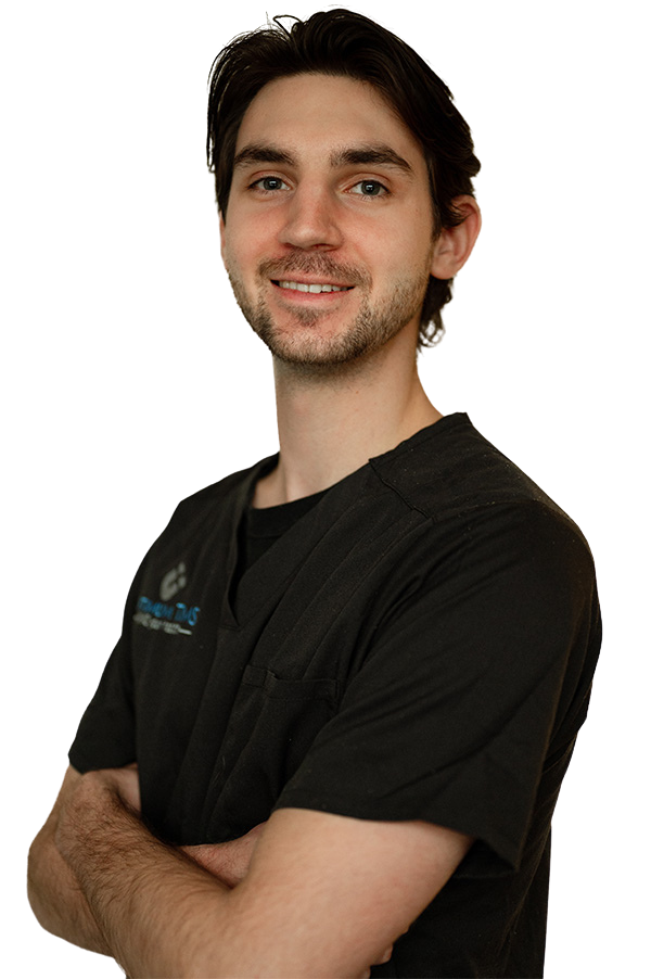 A man wearing a black shirt with the word dental on it