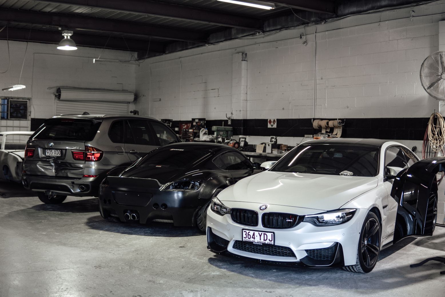 Three Cars Inside Mechanic Shop — Panel Beaters in Southport, QLD