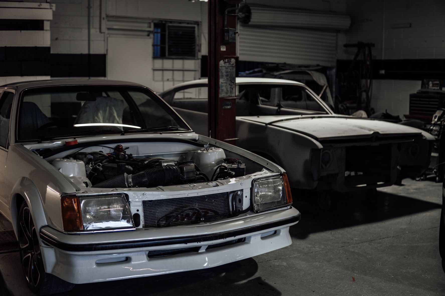 Two Cars Inside Workshop Shop — Panel Beaters in Southport, QLD