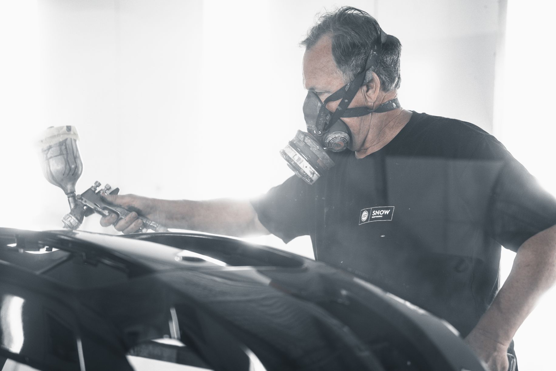 Man With Mask Applying Spray Paint On Car — Panel Beaters in Southport, QLD
