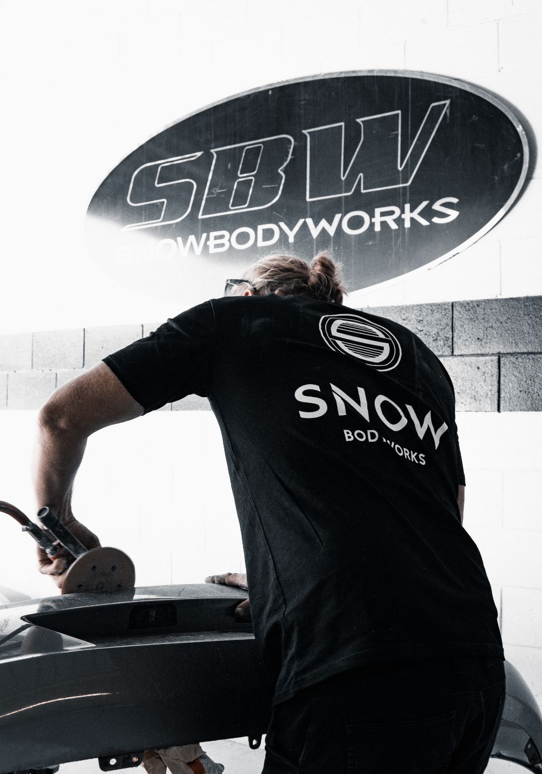 Man Polishing The Bumper Of The Car — Panel Beaters in Southport, QLD