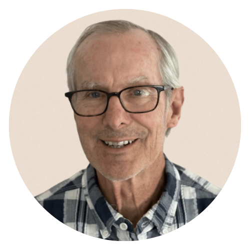 Wind-swept sand dunes forming parallel ripples and shadows in a desert landscape.