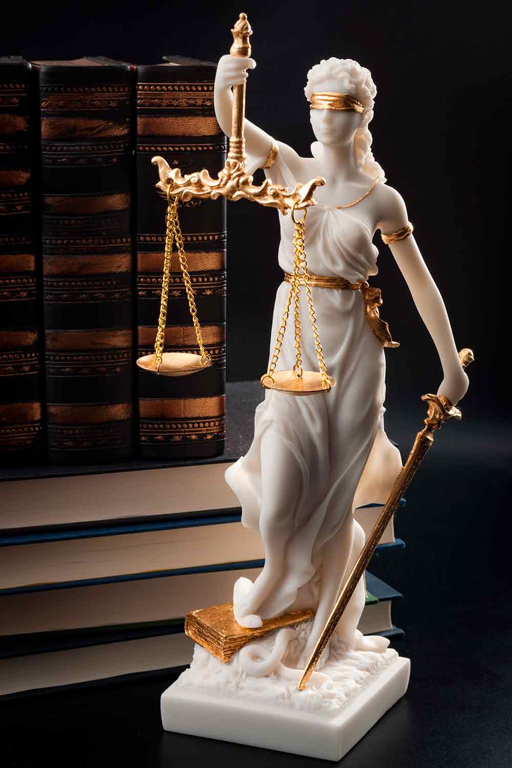 White Marble Statue of Lady Justice on Black Background— Family Law in Amsterdam, NY