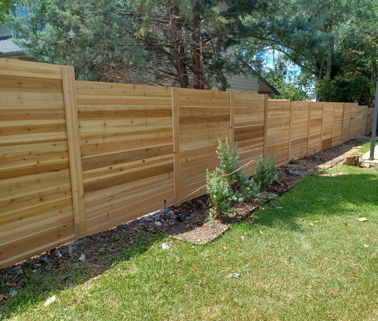 Pflugerville Pfence Company fencing, wrought iron, gates, decks, and patio installation in Central Texas and Austin.