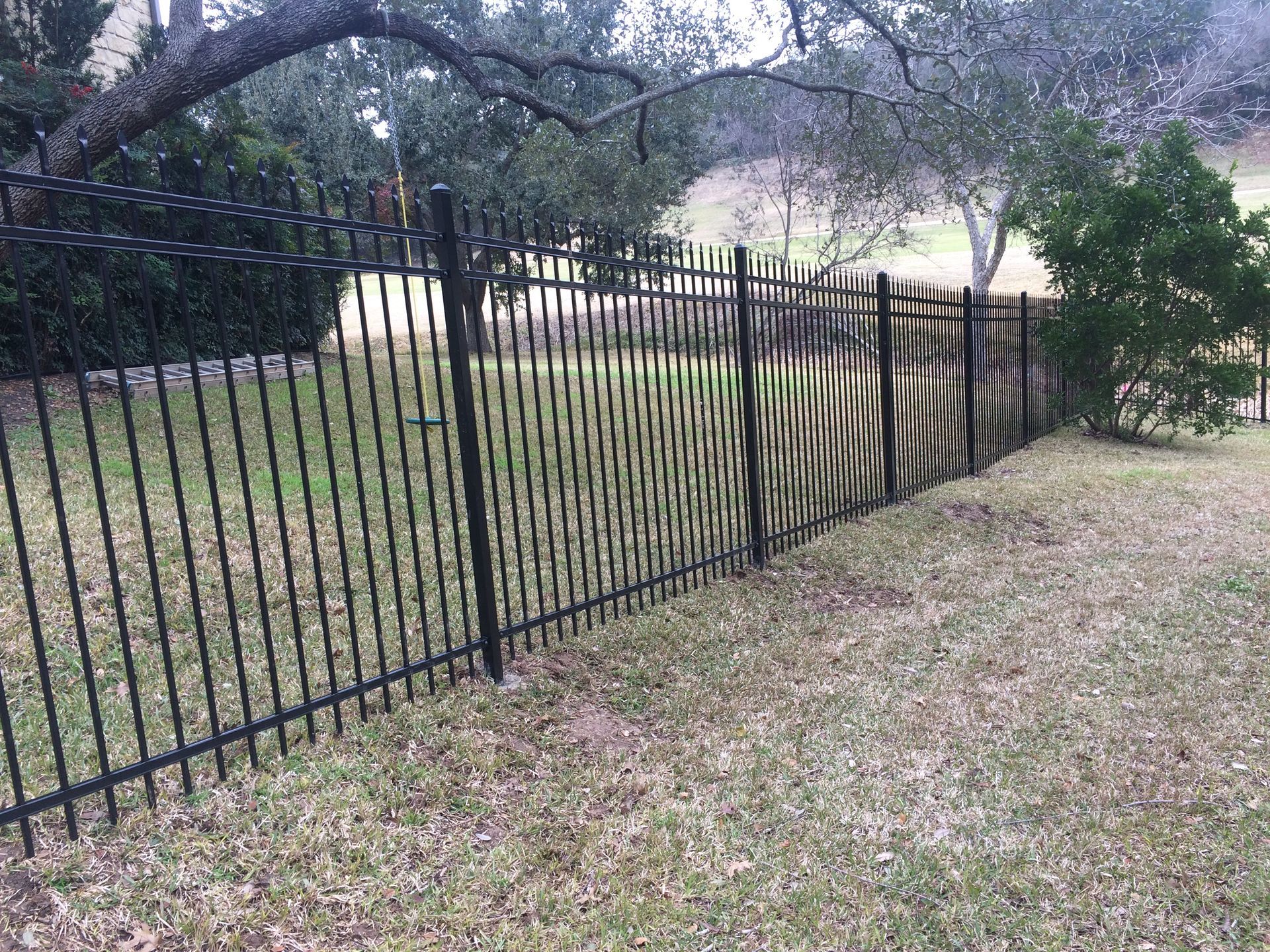 Pflugerville Pfence Company fencing, wrought iron, gates, decks, and patio installation in Central Texas and Austin.