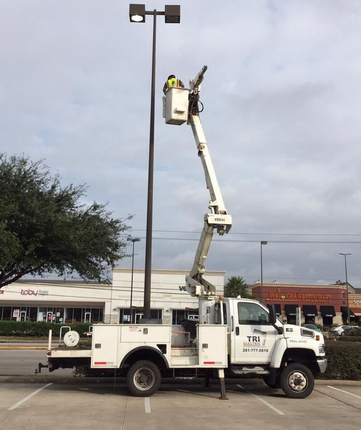 A wooden fence is sitting on top of a lush green field.