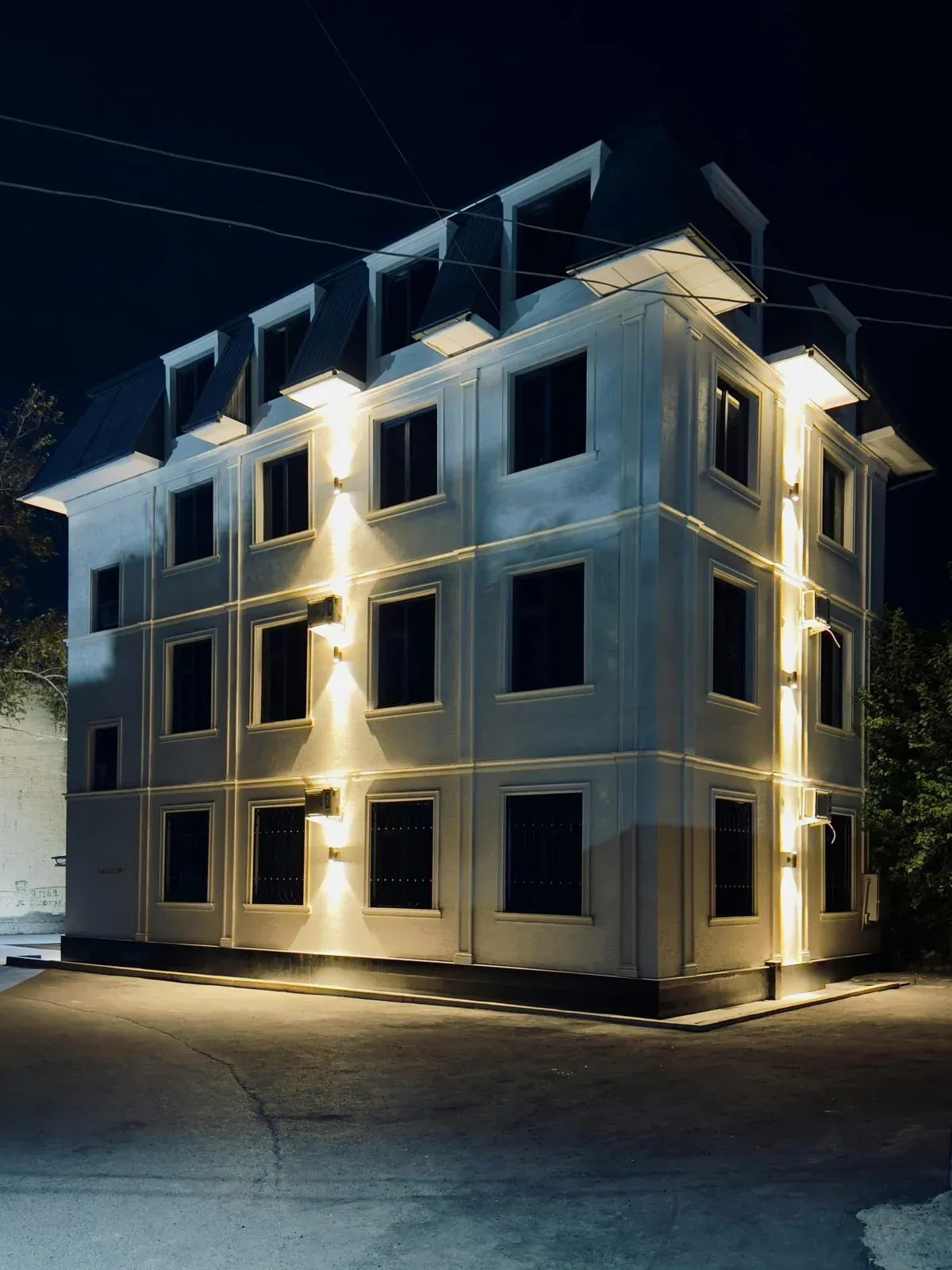 A wooden fence is sitting on top of a lush green field.