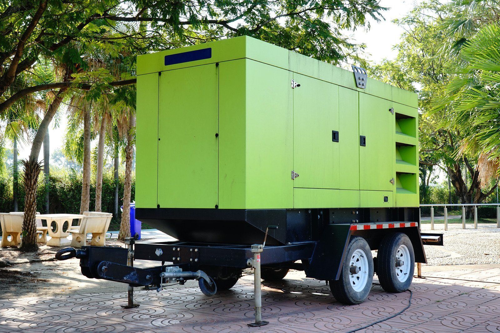 A wooden fence is sitting on top of a lush green field.