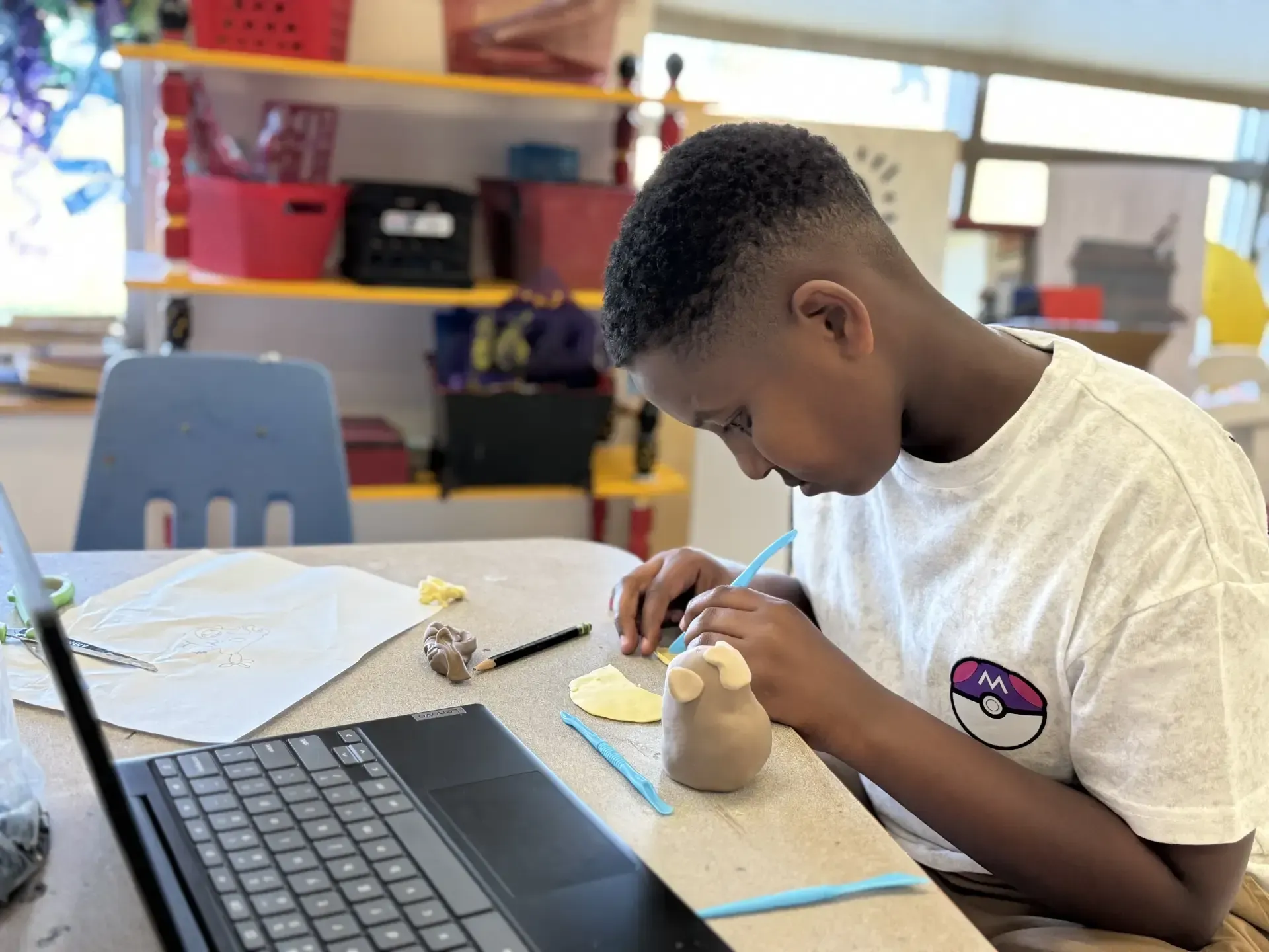 Montessori child working with modeling clay