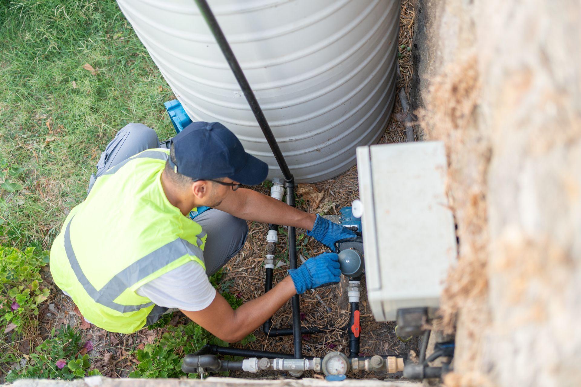 Plumber repairing automatic water pump.