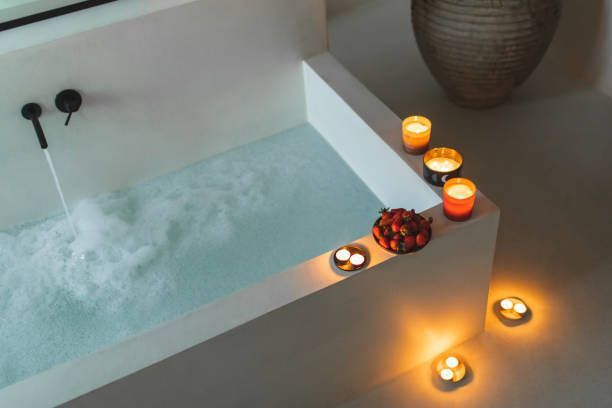Bathtub Filled with Foam and Candles — Seattle, WA — Quality Plumbing