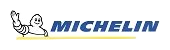 Michelin logo featuring the Michelin Man and the brand name. The man has a smile, and the text is blue.