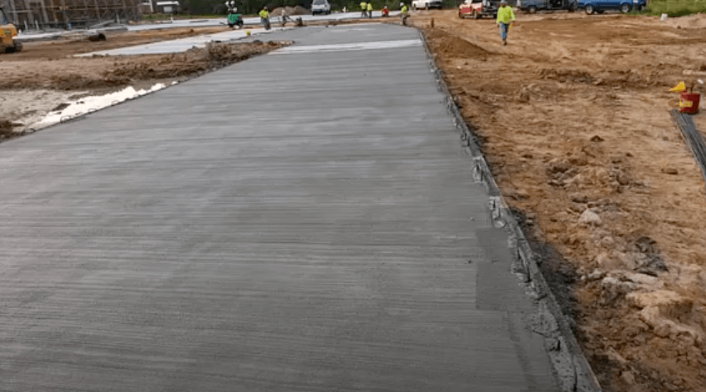 Concrete company pours a 1000 foot long walkway for a commercial location in Oswego, IL