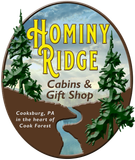 A logo for hominy ridge cabins and gift shop