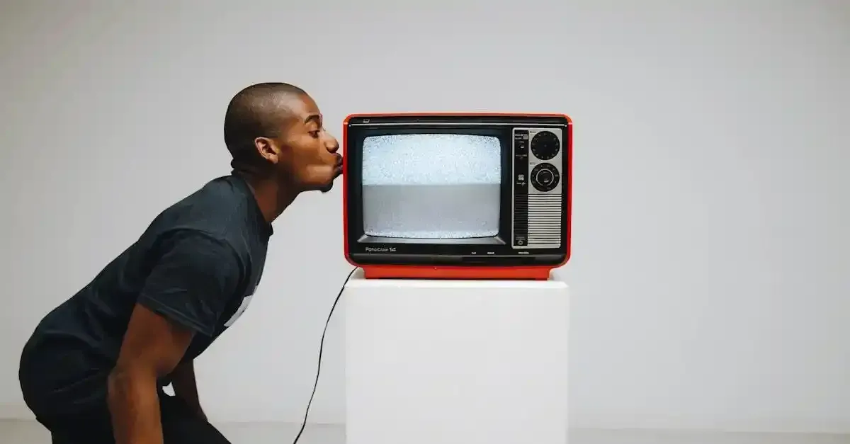 A man kissing a TV streaming online content, showing the comfort and convenience of home entertainment through online live-streaming
