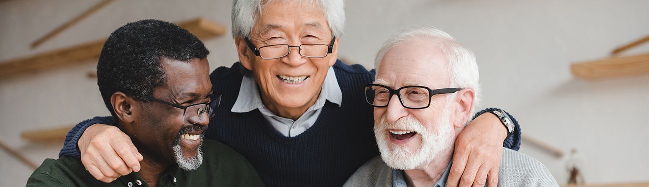 3 senior adult men looking happy together