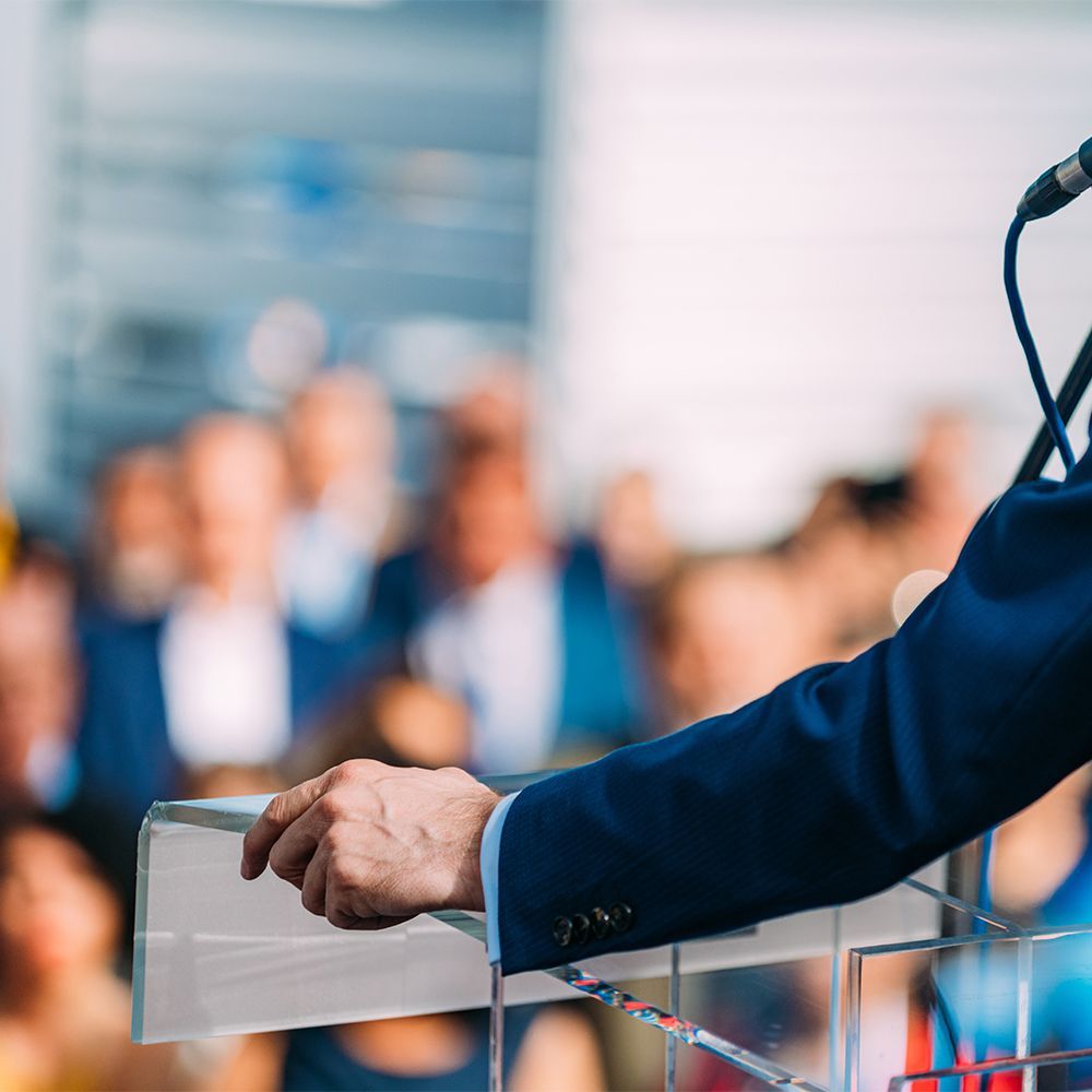 A politician at a podium 