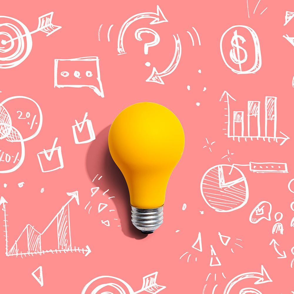 Yellow lightbulb on a pink background with white sketched business icons.