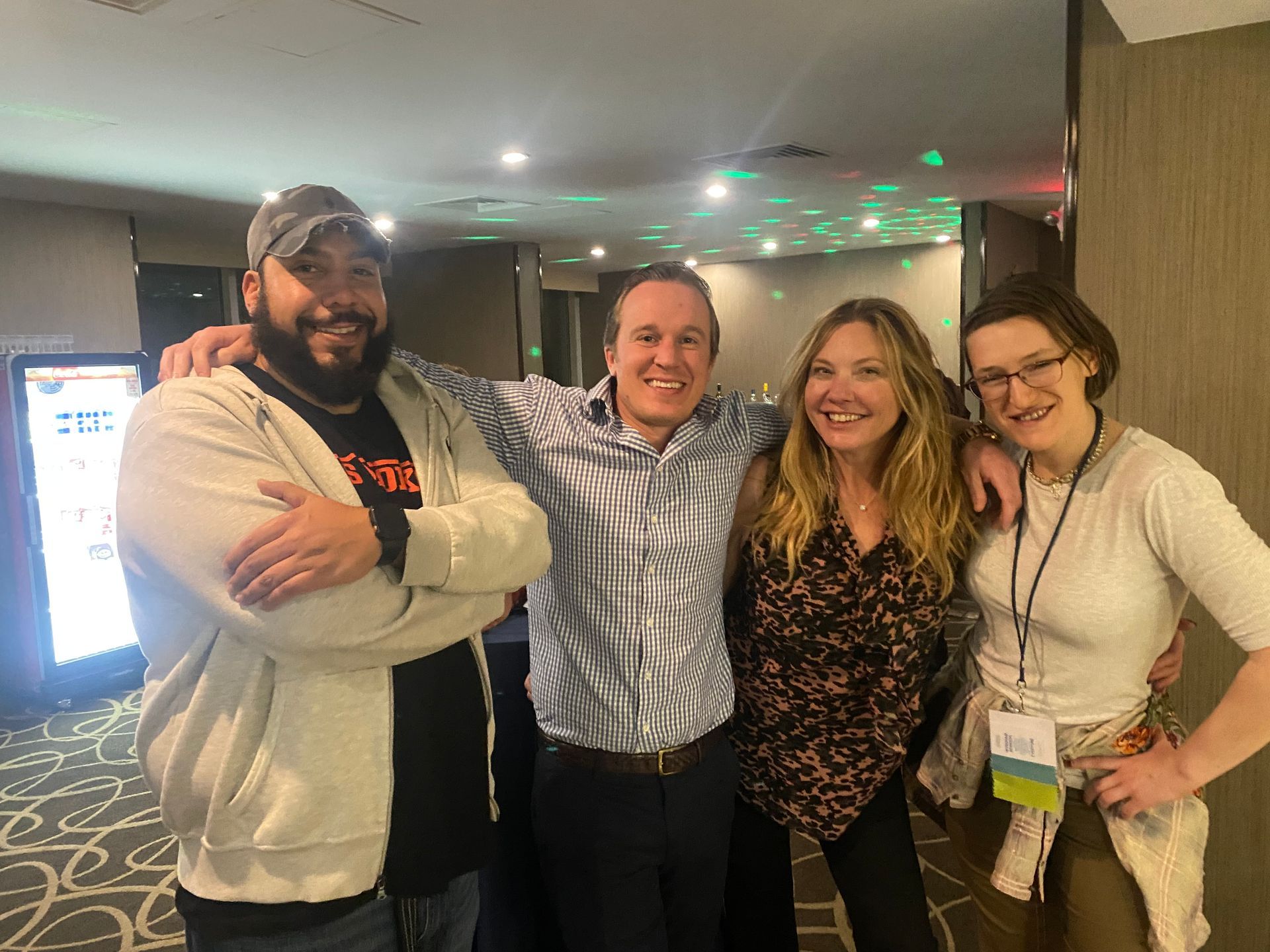 Four people smiling for the camera