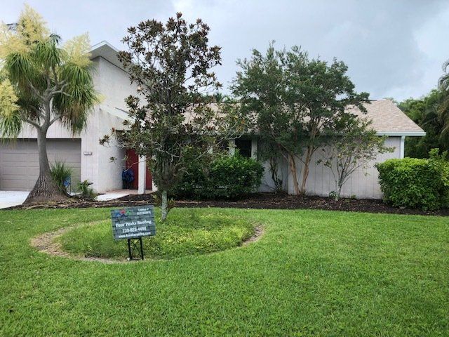 A house for sale in Cape Coral with a newly installed roof by Four Peaks Roofing