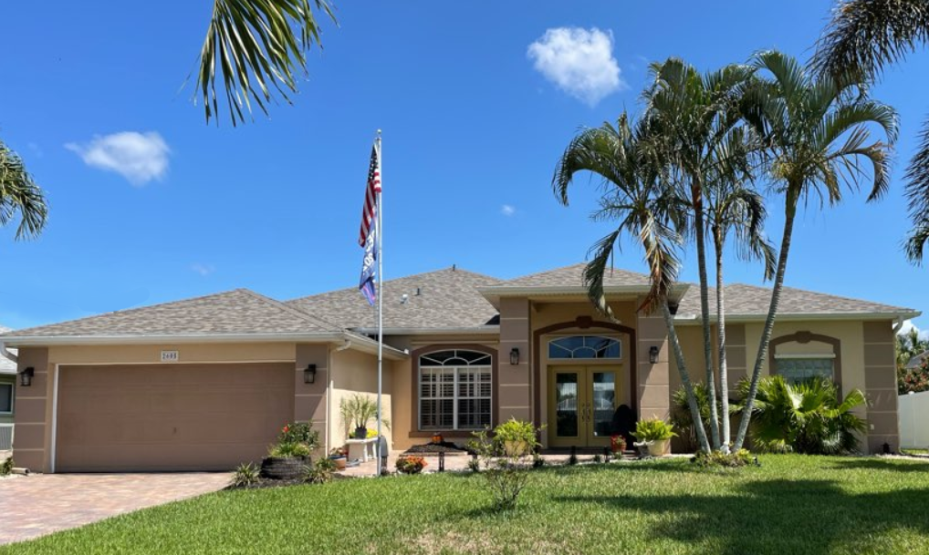 A large house in Cape Coral had a new roof installed by Four Peaks Roofing