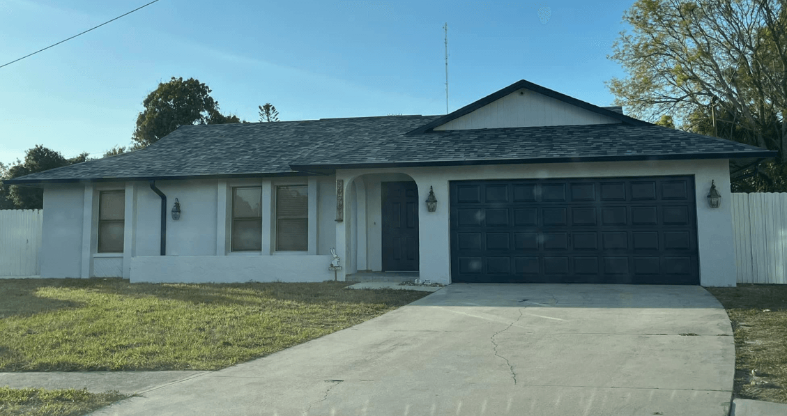 A Cape Coral house with a new tile roof installed by Four Peaks Roofing