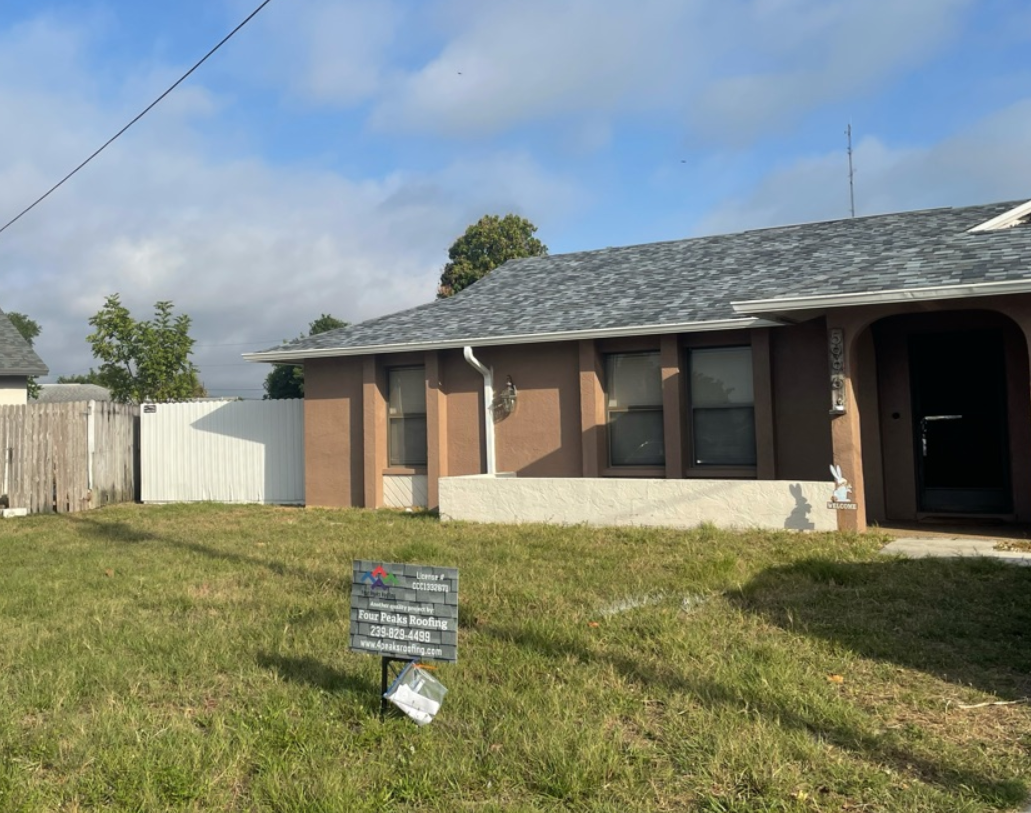 A house with a gray roof by Four Peaks Roofing in Fort Myers