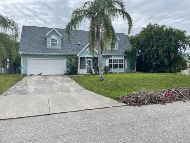 A house with a newly installed roof by Four Peaks Roofing in Bonita Springs