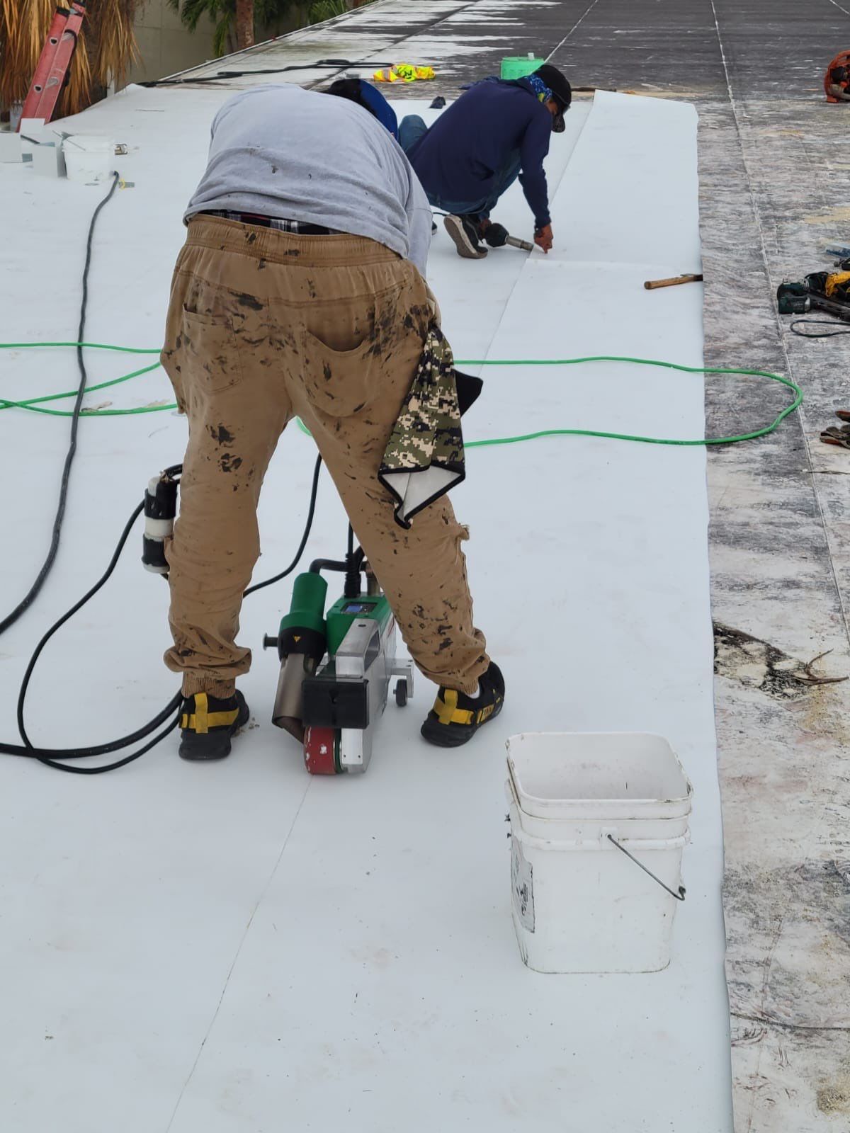 Four Peaks Roofing is working on a new white roof in Fort Myers