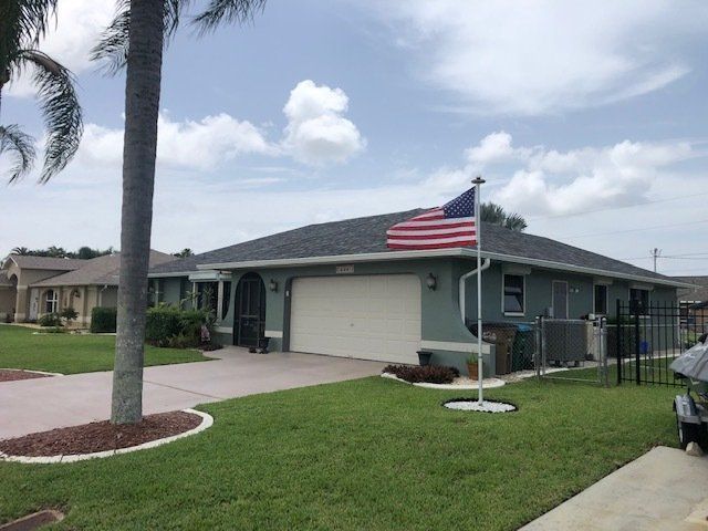 A house with a new roof project by Four Peaks Roofing in Cape Coral