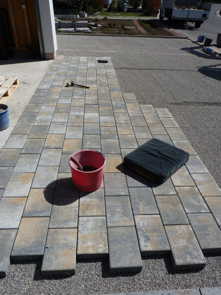 Driveway Under Construction With Pavers, Red Bucket, and Black Mat — Rhyno’s Concreting In Old Bar, NSW