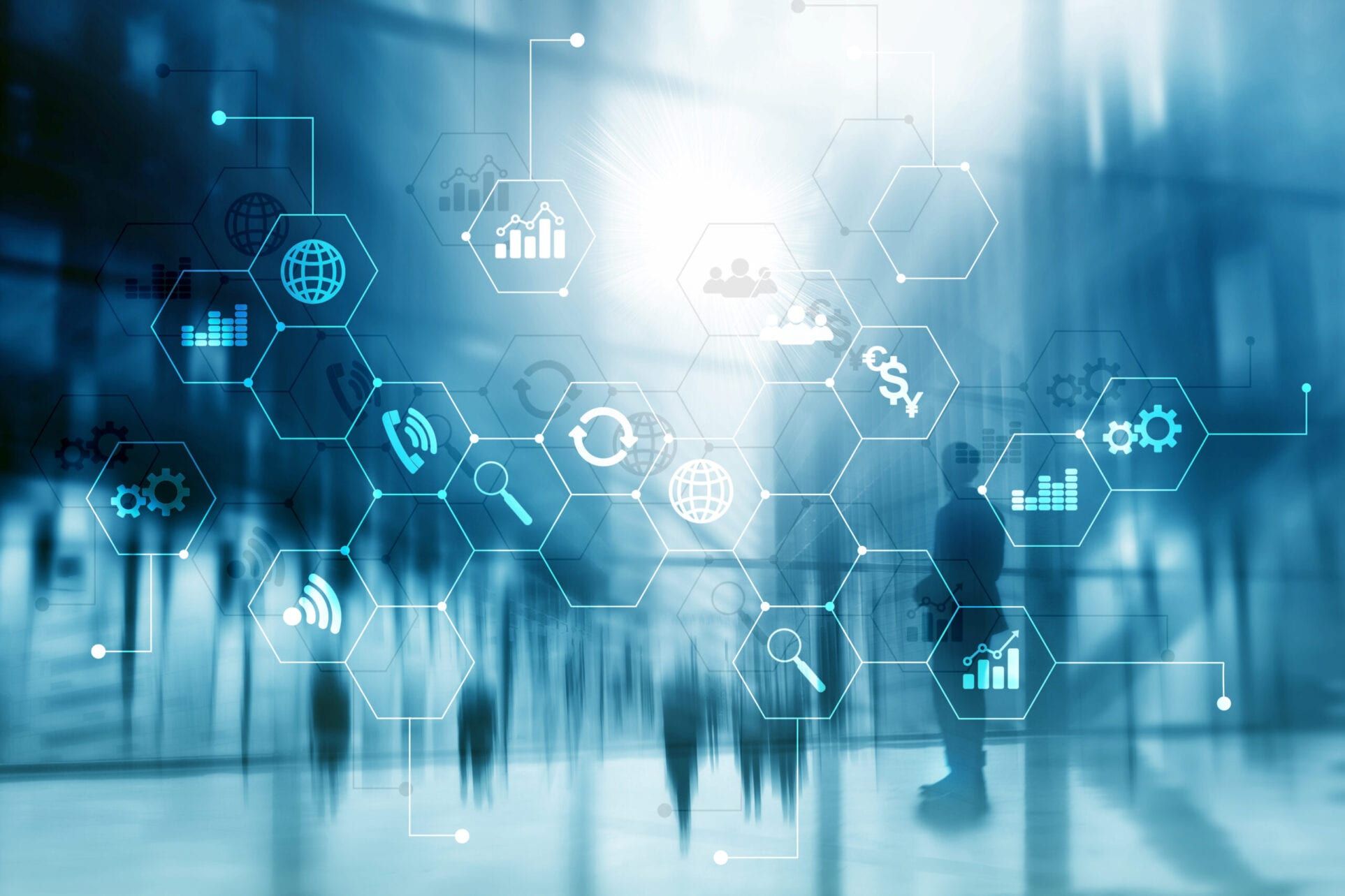 A group of people standing in front of a screen with icons on it.