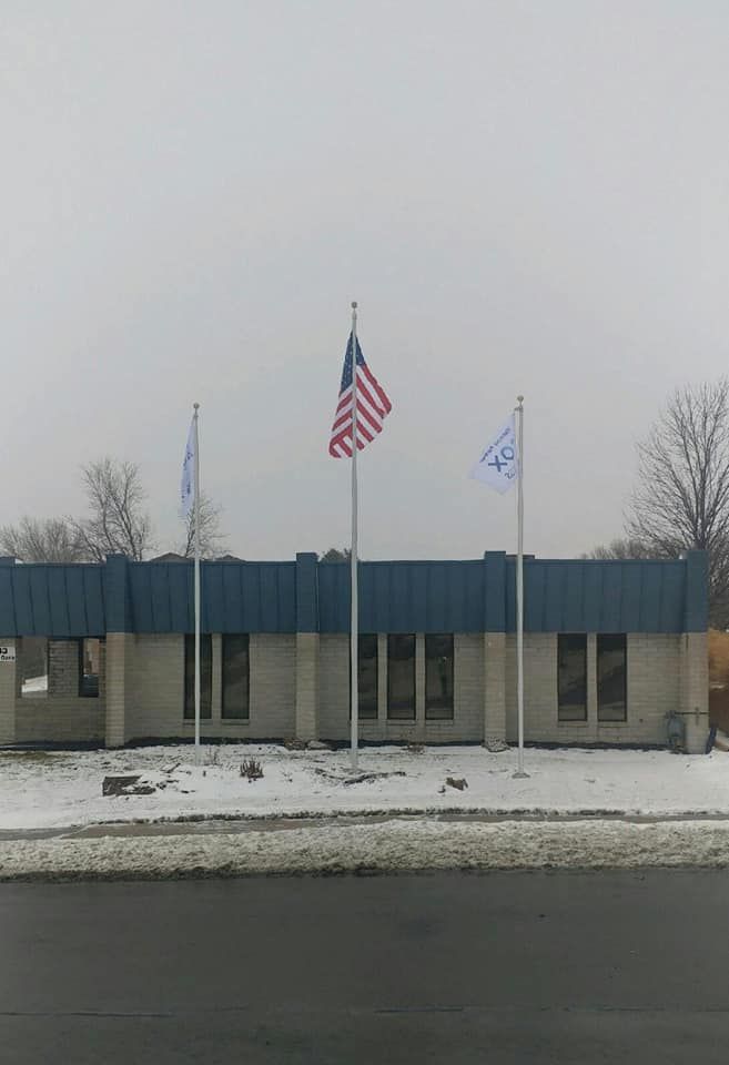 25 Silver Flag Pole With Signage — Omaha, NE — A -1 Flags, Poles, and Repair