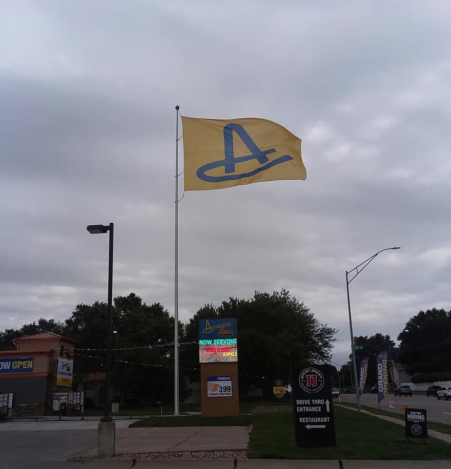 A yellow flag with the letter a on it