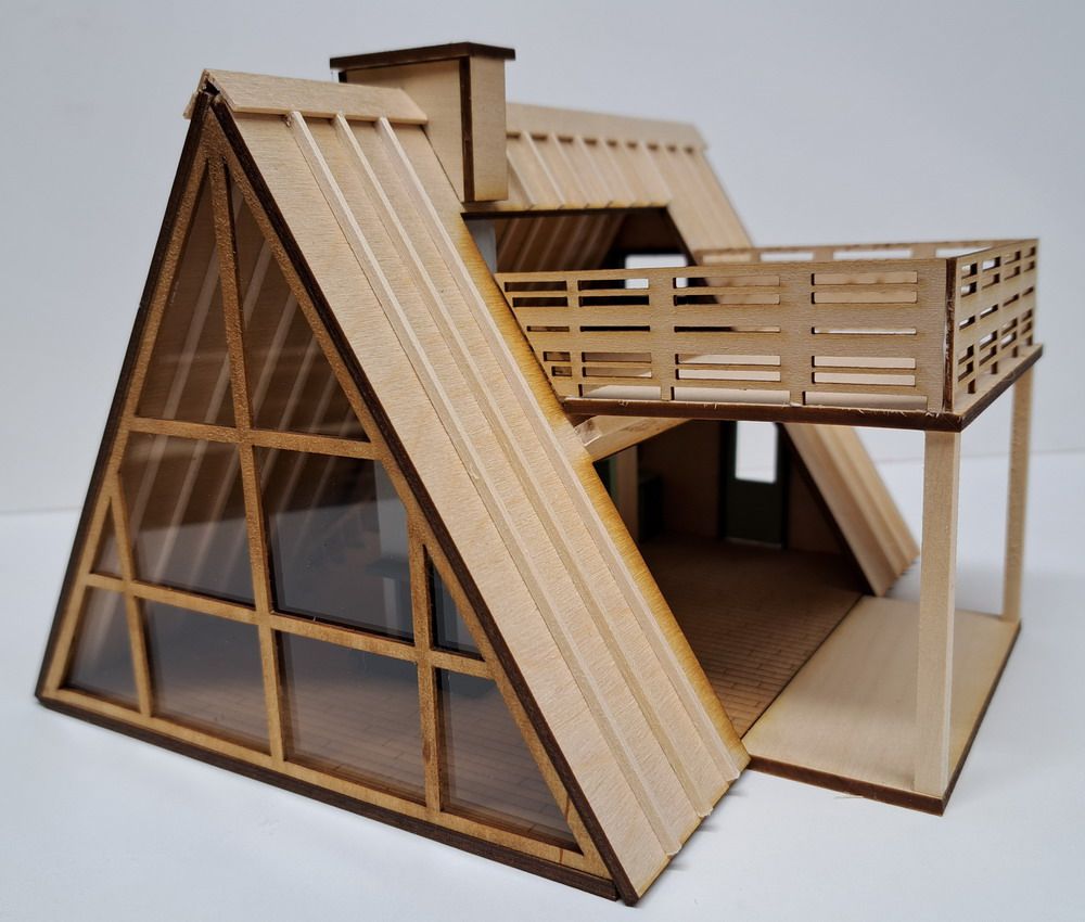 Wooden A-frame tiny house model with large windows and an elevated deck