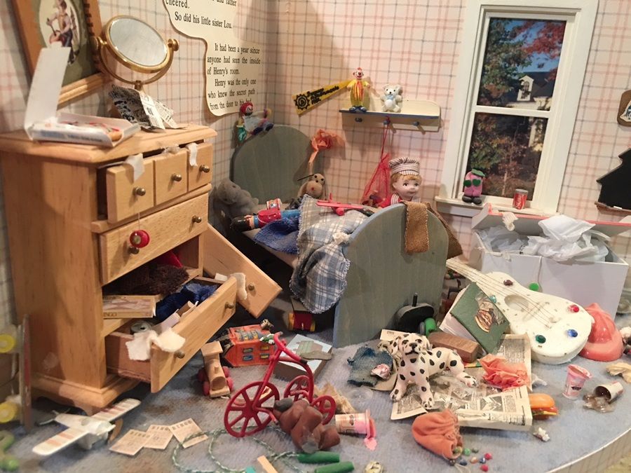 Cluttered dollhouse bedroom with scattered toys, a broken chair, and furniture in disarray