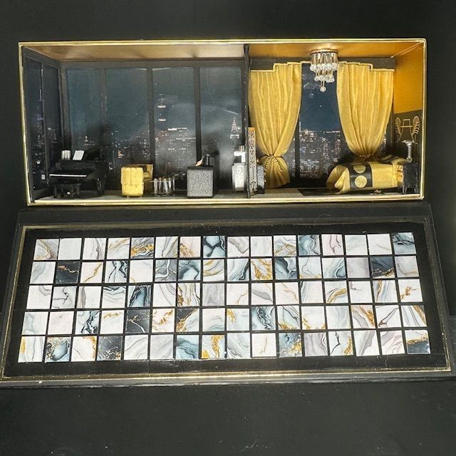 Miniature room display with yellow curtains above a tiled mosaic floor