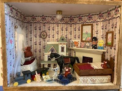 Miniature dollhouse room with patterned wallpaper, fireplace, piano, and small figurines on display.