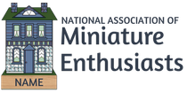 Logo for National Association of Miniature Enthusiasts with a small house and nameplate