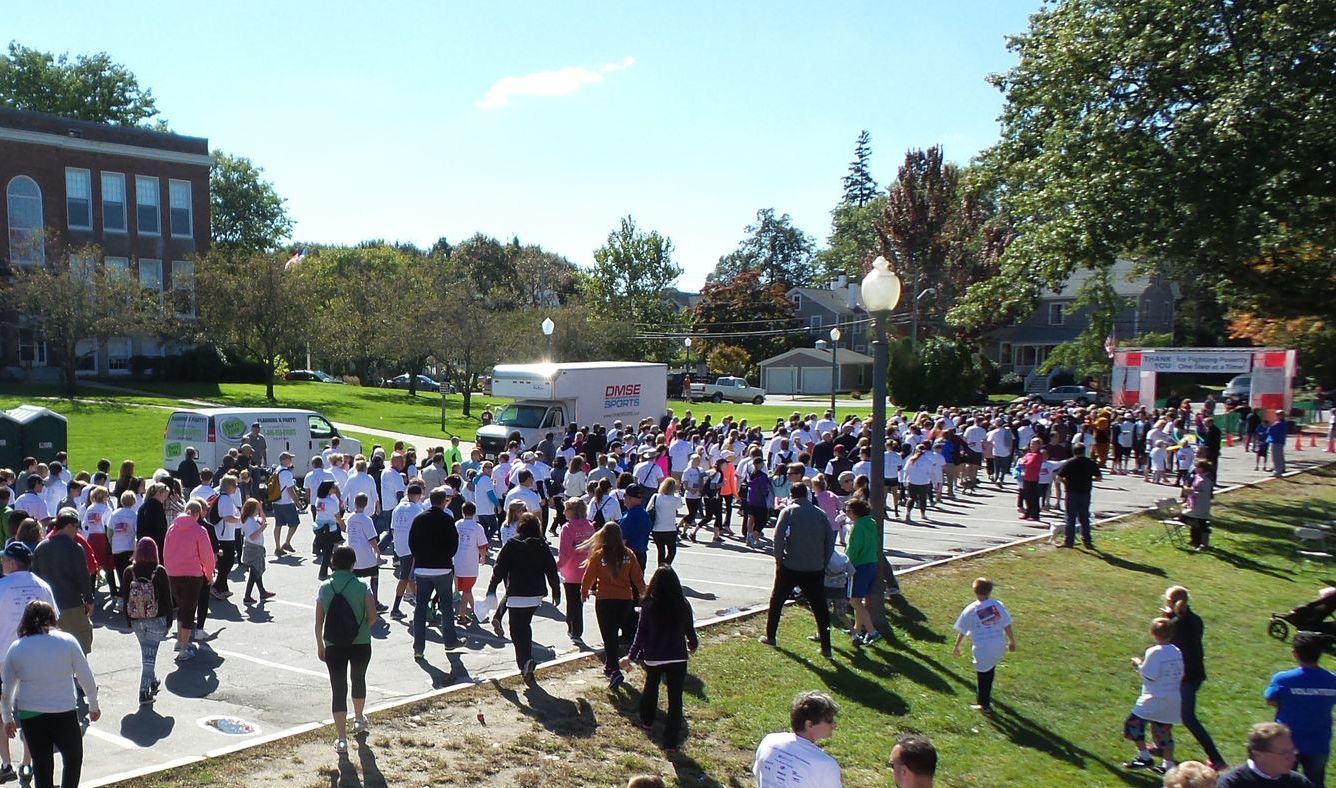 Hike For Hope in Andover with PartyTime Events providing DJ Music and Games for  large group of people are walking down a street