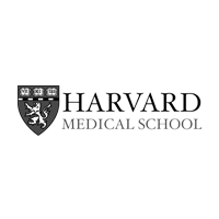 The harvard medical school logo is black and white and has a lion on it.