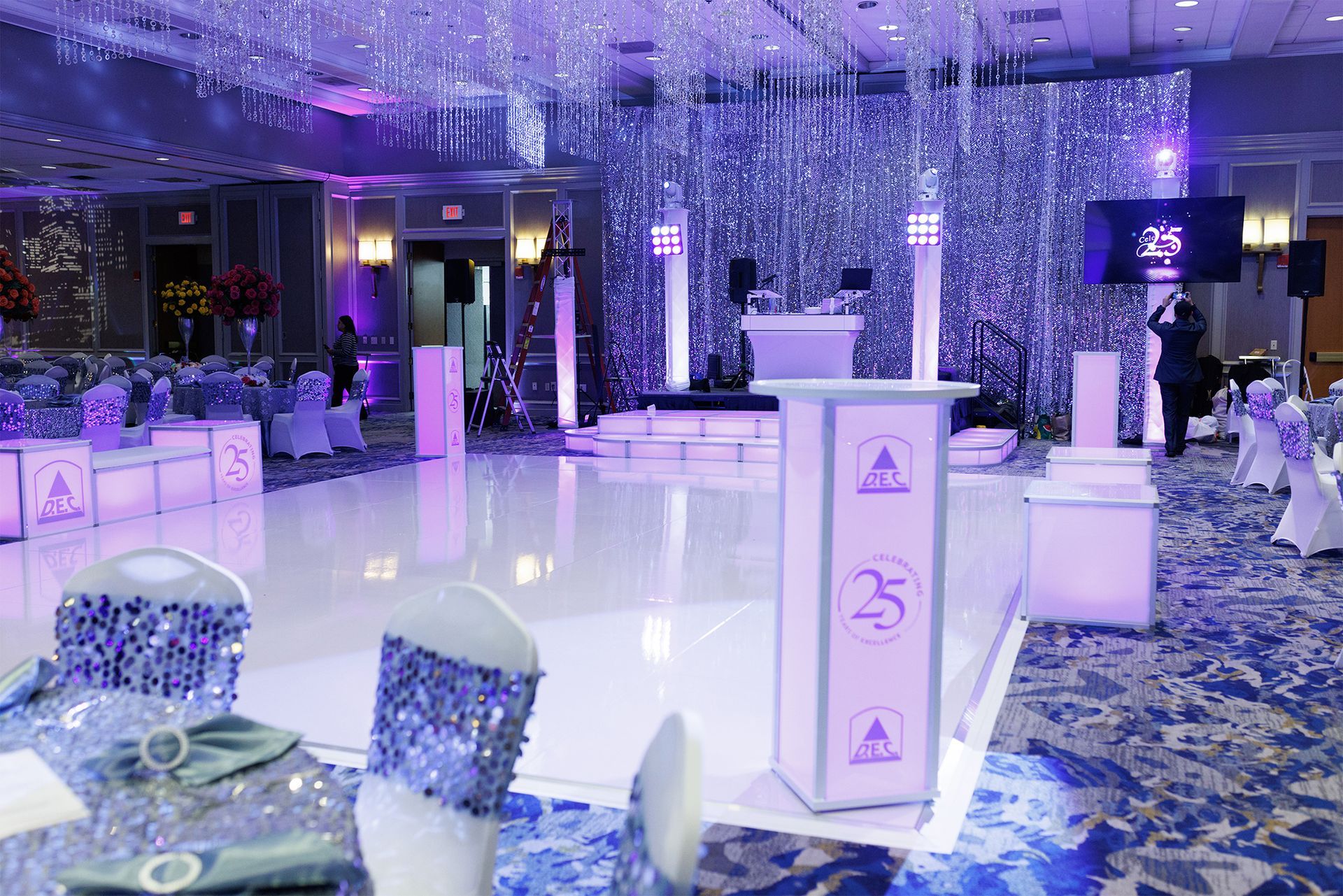 25th Company Anniversary Party with White Dance Floor and Lit Staging and Hi-Top Tables along with Truss Mounted OLED TV's and Party Time Events DJ Setup