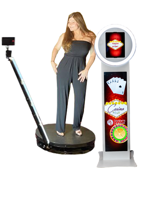 A woman is standing in front of a photo booth.