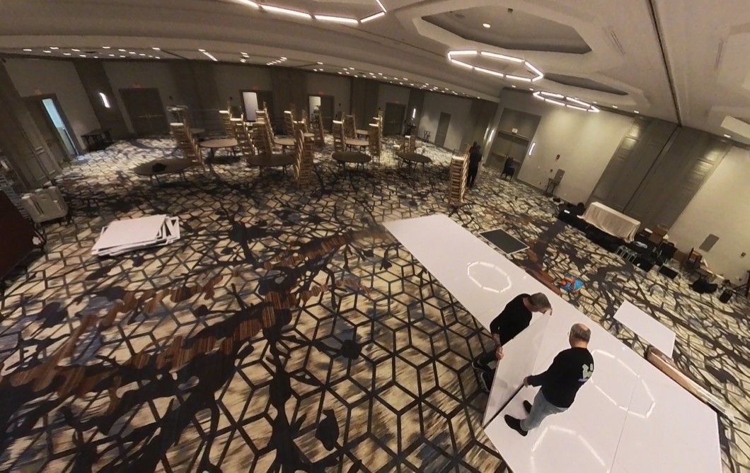 Harvard Boat Club empty room with round tables in the middle and pictures on wall