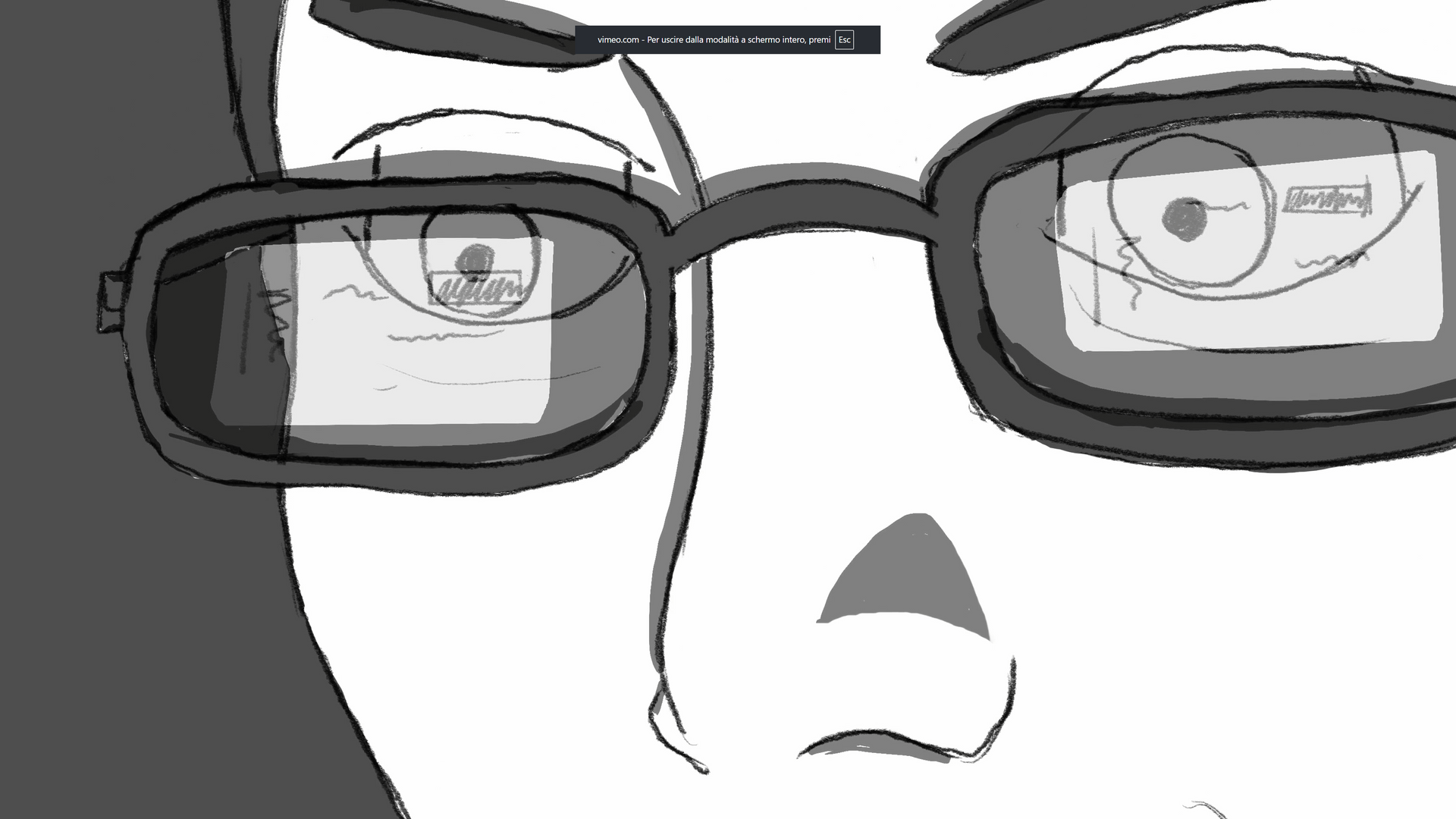 Close-up of a person wearing glasses with screen reflections, looking at a computer.
