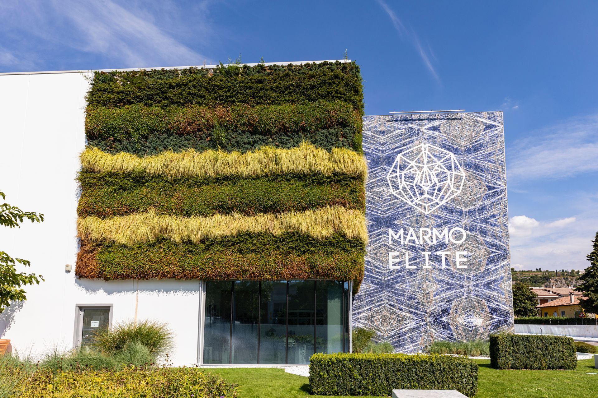 Building with a vertical garden and mosaic facade; 