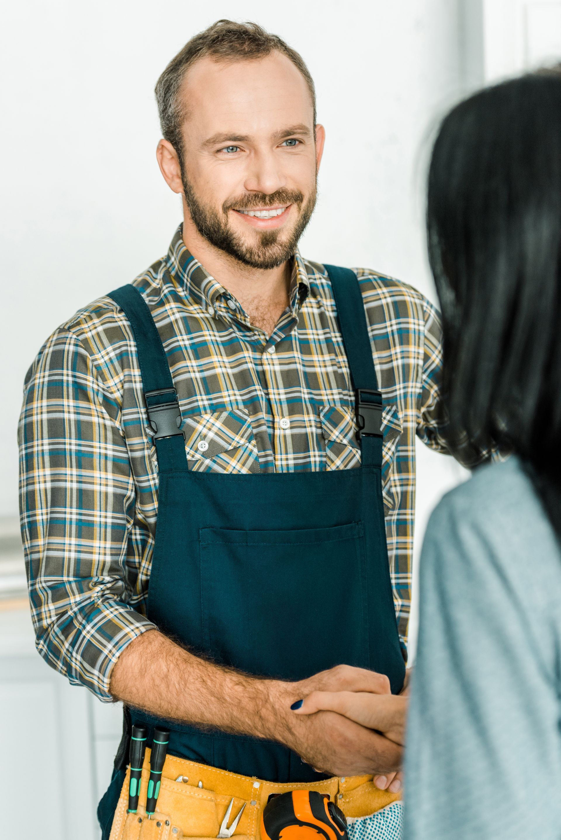 plumber shaking hands with client